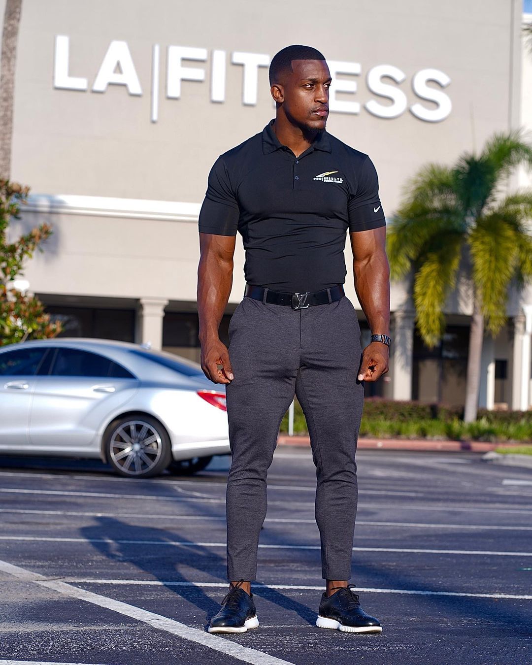 Ashton Hall full body standing outside fitness building posture check