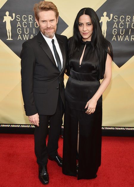 Willem Dafoe and Giada Colagrande height comparison
