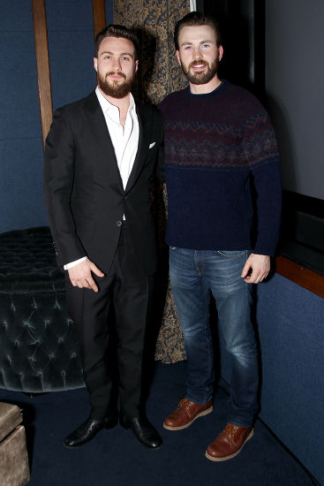 Aaron Taylor-Johnson standing with Chris Evans height comparison