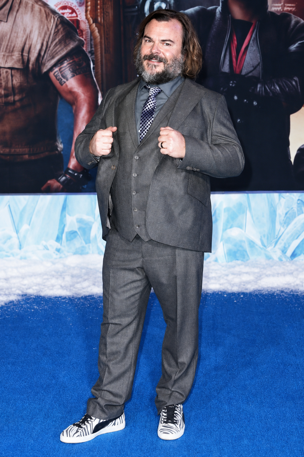 Jack Black standing in a full-body photo